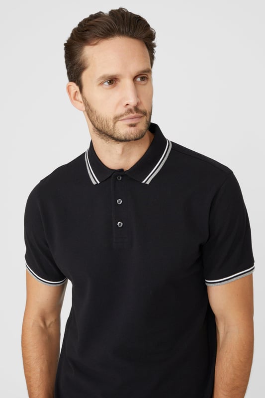 Introducing our Pique Tipped Polo, the perfect addition to any man's smart casual wardrobe. Crafted with meticulous attention to detail, this polo offers a sophisticated and polished look. The pique fabric provides a comfortable and breathable feel, making it ideal for all-day wear. With its stylish tipped collar and cuffs, this polo adds a touch of elegance to any outfit. Whether you're heading to the office or out for a casual gathering, our Pique Tipped Polo is the ultimate choice for a smart and effortlessly stylish look.
