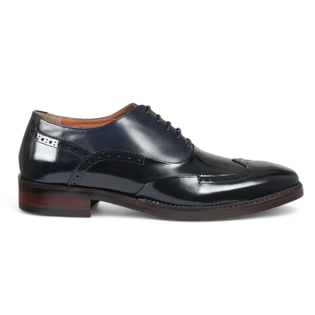 Make a bold impression with the Justin Reess Harry Men's Patent Leather Brogue Shoes in striking green. Crafted from vibrant green patent leather, these shoes are designed to stand out and elevate your formal attire. Featuring a classic brogue design with intricate perforations and decorative stitching, they embody elegance and sophistication for any occasion. The secure lace-up closure allows for a customizable fit, ensuring comfort throughout the day. Built with high-quality materials and expert craftsmanship, these shoes offer durability and longevity, making them a stylish addition to your wardrobe.

Striking Green Patent Leather for a bold statement
Classic Brogue Design with elegant perforations
Lace-Up Closure for a secure, adjustable fit
Durable Construction for long-lasting wear