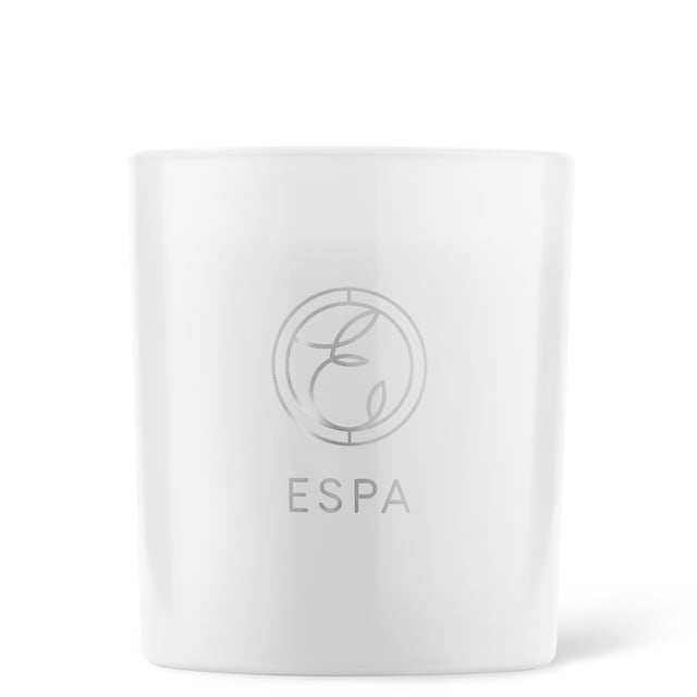 This hand-poured natural soy wax candle harnesses the power of essential oil aromatherapy. Restore tranquility, ease the mind and body, and transform your space into a sensorial haven.

Featuring The Soothing Signature Blend composed with mellow Myrrh, heady Rose Geranium, and warm Frankincense. Sink into serenity for the body and mind.

Housed in a timeless vessel, ensuring that your space is elegant. Beautifully created with white glass and finished with a chic metal lid. In a convenient 200g size.

Key Features:

Crafted from pure Essential Oils
100 percent Soy Wax
Hand poured
White glass Vessel
Convenient 200g size
