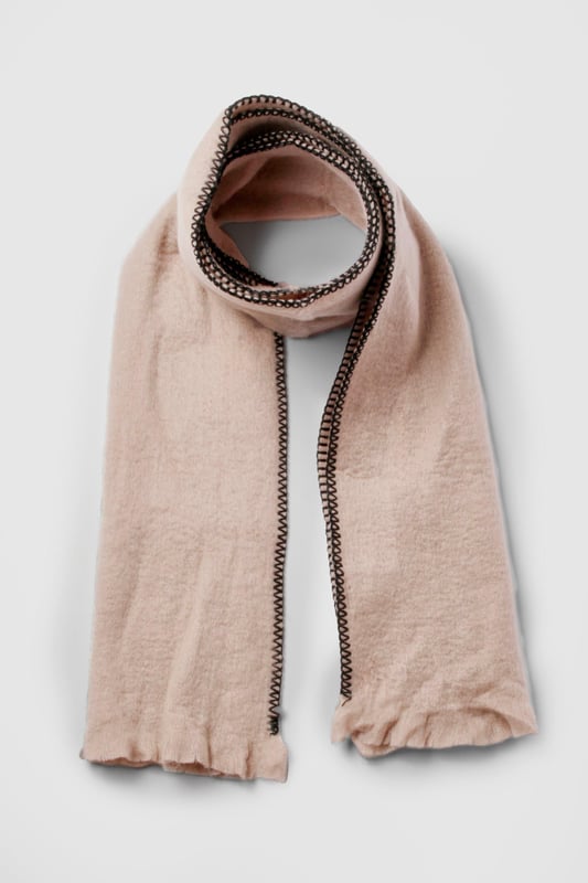 Blanket Stitch Trim Knitted Scarf Knitted scarf with distinctive stitch detailing
Contrasting edge stitching for a stylish finish
Generous length for versatile styling options
Soft, cosy texture for ultimate comfort
Subtle fringe detailing at the ends for added flair
Wrap yourself in effortless style with this chic knitted scarf from Boohoo. The eye-catching stitch detailing and contrasting edge stitching add a touch of sophistication to this casual accessory. Perfect for those chilly autumn days or crisp winter evenings, this scarf is your go-to companion for staying warm whilst looking fabulous. Drape it loosely over a leather jacket for an edgy look, or wrap it snugly around your neck with a cosy jumper for a more laid-back vibe. Its versatility makes it ideal for various casual occasions, from coffee dates with friends to family gatherings. The generous length allows for multiple styling options, so you can customise your look to suit your mood. Whether you're heading to the shops or enjoying a weekend stroll in the park, this scarf will keep you looking trendy and feeling snug.