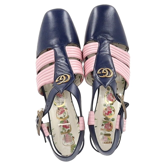VINTAGE, RRP AS NEW
Step into luxury with the Gucci GG Logo T-Strap Mid-Heeled Sandals in vibrant blue and pink leather. These eye-catching sandals feature the iconic GG logo, beautifully blending high fashion with playful color. The T-strap design provides a flattering silhouette, while the mid-heel offers comfort and stability for all-day wear. Perfect for dressing up a casual outfit or adding flair to an evening ensemble, these sandals are a versatile addition to your footwear collection. Elevate your style and make a bold statement with these stunning Gucci sandals.

Gucci GG Logo T-Strap Mid-Heeled Sandals in Blue and Pink Leather

Condition: Very good
Signs of wear: Minor signs of wear
Packaging: Dust bag
Color: Multicolor
Material: Leather | leather
Size: EU36.5/UK3.5/FR37.5/IT36.5/US6.5
Measurements: Heel height: 80; Insole length: 260
SKU: NAPPUGBSH400793W