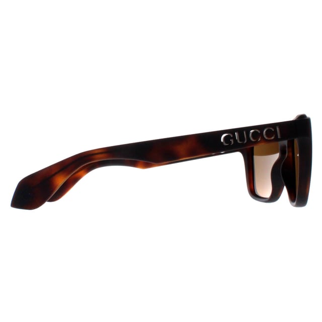 Gucci Rectangle Unisex Havana Brown GG1571S  Sunglasses showcase a contemporary rectangle design that seamlessly merges sophistication with bold fashion. The sleek and refined frame, adorned with the iconic Gucci logo detailing on the temples, exudes luxury at every glance. Precision engineered from premium materials, these shades prioritize comfort without compromising on durability, making them the perfect accessory for both fashion aficionados and trendsetters. Whether you're lounging poolside or striding through the city streets, the Gucci sunglasses are a testament to refined taste and unparalleled craftsmanship.