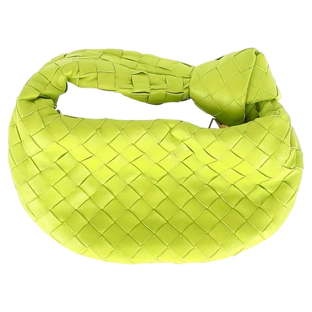 VINTAGE, RRP AS NEW
Chic and Luxurious: Elevate your style with the Bottega Veneta Mini Jodie Handbag in Green Intrecciato Leather, a chic and luxurious accessory that exudes understated glamour. The intricately woven leather in a stunning green color adds texture and dimension to the structured silhouette, while the compact size makes it the perfect statement piece for any outfit. This handbag is a symbol of impeccable craftsmanship and exquisite design.

Bottega Veneta Mini Jodie Handbag in Green Intrecciato Leather
Condition: Very good
Signs of wear: No retail tag, Minor sign of wear or markings., Lightly used but very well maintained. Minor creasing, light worn corners, light scratches.
Packaging: Dust bag
Color: Green
Material: Leather 
Size: One size
Measurements: Width: 30; Height: 130; Length: 240
SKU: NAPPUGBBA371345W