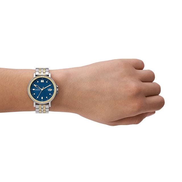 This Skagen Signatur Sport Lille Analogue Watch for Women is the perfect timepiece to wear or to gift. It's Multicolour 34 mm Round case combined with the comfortable Multicolour Stainless steel watch band will ensure you enjoy this stunning timepiece without any compromise. Operated by a high quality Quartz movement and water resistant to 5 bars, your watch will keep ticking. Elegant and fashionable watch that is suitable for the daily life of every Women. This Analogue watch has a calendar function: Date , Luminous Hands and Luminous Numbers High quality 19 cm length and 16 mm width Multicolour Stainless steel strap with a Fold over with push button clasp Case diameter: 34 mm,case thickness: 8 mm, case colour: Multicolour and dial colour: Blue
