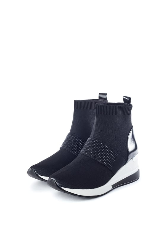 Create an impression in Crystal. This sock trainer features a wedge heel for added height with a glitz trim band for a glamourous feel - who says you can't look good whilst you're on the go?