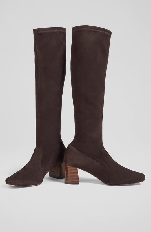 LK Bennett Davina Knee Boots, Chocolate Stretch boots are an LKB signature, and our Davina knee-high boots offer a sleek look and a comfortable fit in velvety-soft suede. Crafted in Spain from chocolate brown stretch suede, they have a square toe, a slim fit and a 60mm stacked block heel. Pull them on under winter skirts and dresses when it's time to up the winter layers.