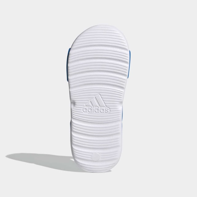 Sunscreen, check. Bucket hat, check. Blow-up unicorn? Maybe later. Let your aquanaut explore the shore in these kids' adidas sandals. Adjustable hook-and-loop straps create a snug fit that adds oomph as they skip stones. A grippy outsole leaves tracks in the sand as the sun sets on their perfect day.  - Regular fit - Hook-and-loop closure - EVA bandage upper - Textile lining - Contoured footbed - Lightweight EVA outsole  Shipped by adidas