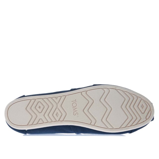 Womens Toms Recycled Cotton Canvas Alpargata Espadrille Pumps in navy.- Recycled cotton upper  lining and sock-liner made with 50% recycled cotton.- Classic Alpargata design.- Toe-stitch and elastic V for easy on and off.- Chevron patterned canvas lining.- Custom insoles made with 50% eco content including recycled PU foam.- Direct injection outsole for flexibility and durability with tread pattern for improved traction.- Toms branding to side and back of heel.- 100% vegan construction.- Textile upper  Textile lining  Synthetic and textile sole.- Ref:10017712