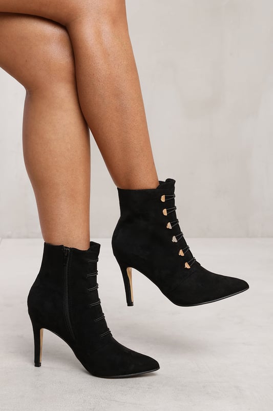 Step out in style with our Leane Pointed Toe Mid Heel Ankle Boots with Gold Buttons. These fashionable ankle boots are designed to add a touch of sophistication and flair to any outfit.Key Features:



Chic Design: The pointed toe and gold buttons on these ankle boots create a stylish and eye-catching look. These boots effortlessly elevate your style, making you stand out from the crowd.

Comfortable Fit: Despite their sleek design, these ankle boots prioritize your comfort. The mid heel provides a comfortable lift, while the pointed toe allows for a snug fit and adds a touch of elegance.

Durable Construction: Made with high-quality materials, our Pointed Toe Mid Heel Ankle Boots with Gold Buttons are built to last. The sturdy construction and reliable stitching ensure their durability, making them perfect for everyday wear.

Easy to Wear: These ankle boots feature a convenient side zipper closure, allowing for easy on and off. The gold buttons add an extra touch of luxury to the design.


Specifications:


Material: Faux Suede
Closure: Zip
Heel Height: 3.9 inches
Toe Shape: Pointed Toe

Invest in our Leane Pointed Toe Mid Heel Ankle Boots with Gold Buttons for a perfect combination of style, comfort, and sophistication. Make a statement and turn heads wherever you go. Get yours today and step into a world of fashionable elegance!