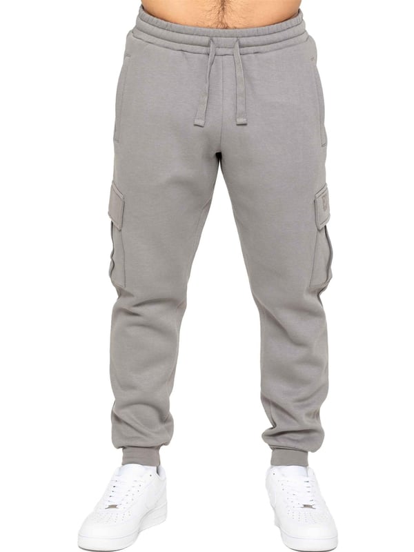 Experience superior comfort and style with Enzo Men's Regular Fit Cargo Joggers! Crafted with a brushed back inner fleece lining, these joggers are designed to keep you cozy all day long. Perfect for casual wear, they feature convenient 2 side slash pockets and 2 cargo pockets, providing ample storage space for your essentials. Stay on-trend with the cuffed leg design, offering a modern silhouette and added comfort.