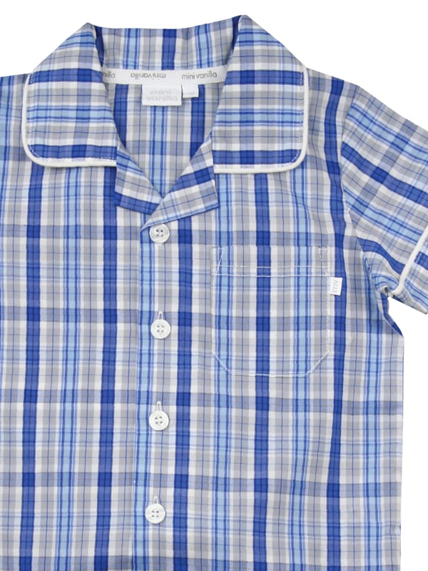 Blue Cotton Check Traditional Summer Pyjamas.

There’s no such thing as a basic check at Mini Vanilla! In our Short sleeve crisp summer cotton boys pyjamas we’ve blended blue, grey and white to create a  traditional look that’s perfect for lounging or sleeping. Made from super-soft 100% crisp cotton. The set is trimmed with white cotton piping. The top has an open collar and revere, single square pocket with MV tab and fastens with Mini Vanilla Engraved buttons. The crisp cotton comfy trousers have a fully soft elasticated waist and white piping at the hem to finish this very traditional boys pyjamas

Sold as a Pyjama set.
Fabric 100% cotton - crisp summer weight.
Fire Warning : KEEP AWAY FROM FIRE AND FLAMES.
Wash Care Instructions : Machine wash inside out, do not soak, wash dark                    colours separately, do not iron trims. Save energy and wash at 30 degrees.
Do not tumble dry