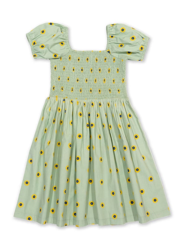 100% organic cotton | Proud to be certified to the Global Organic Textile Standard (GOTS) | Sunflower dot all-over print | Soft sage | Poplin fabric | Elasticated short sleeves | Square neck | Elasticated shirring at chest | Made in India | Machine washable at 40 degrees, or at 30 degrees to be kinder to the planet