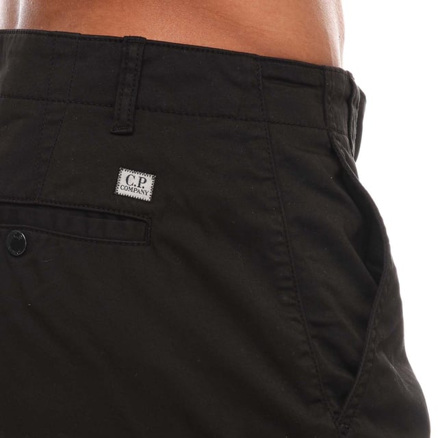 Mens C.P. Company Stretch Sateen Cargo Shorts in black.- Zip fly with button fastening.- Cargo pockets.- Back pockets.- C.P. Company lens logo.- Regular fit.- 98% Cotton  2% Elastane.- Ref: 16CMBE116A999