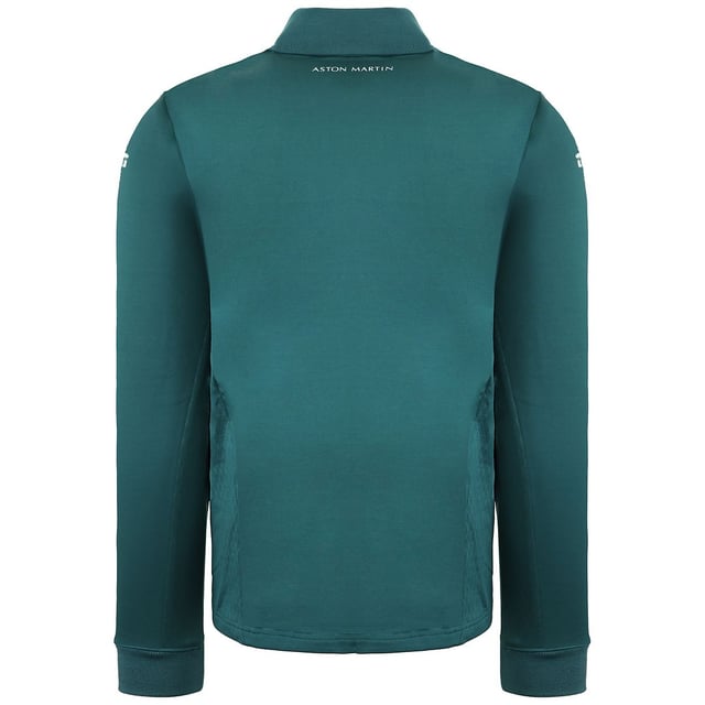 La camiseta Aston Martin F1 Official Team Men's Green Midlayer es una prenda elegante y funcional diseñada para los entusiastas de la Fórmula 1 y los seguidores del Aston Martin Cognizant F1 Team. Estas son las principales características de esta capa intermedia para hombre:

 Mercancía oficial del equipo:  Esta capa intermedia es mercancía con licencia oficial del equipo Aston Martin Cognizant F1, lo que garantiza que representa la marca y la calidad del equipo.

 Diseño verde:  La capa intermedia es predominantemente verde, lo que refleja el color característico del equipo y añade un toque deportivo y elegante a tu atuendo.

 Estilo de la capa intermedia:  Una capa intermedia suele estar diseñada para proporcionar una capa extra de calidez y comodidad sin ser demasiado voluminosa. Es ideal para llevar debajo de una chaqueta o encima de una camiseta.

 Marca del equipo Aston Martin F1:  La capa intermedia suele llevar la marca del equipo, incluidos logotipos y otros elementos asociados a la escudería de Fórmula 1, mostrando tu apoyo y pasión por el equipo.

 Cierre con cremallera: Suele incluir un cierre frontal con cremallera, que permite llevarla fácilmente y regular la temperatura.

 Construcción de calidad:  Los artículos oficiales de Fórmula 1 son conocidos por su calidad, y esta capa intermedia está diseñada para mantener su forma y estilo con el uso regular.

 Uso versátil:  Tanto si asistes a una carrera de F1 como si la ves desde casa o simplemente sigues con tu día a día, esta capa intermedia ofrece calidez y estilo, permitiéndote expresar tu pasión por el deporte y el equipo.

 Uso diario:  Aunque es perfecta para los eventos y carreras de F1, esta capa intermedia también es adecuada para el uso diario, añadiendo un toque deportivo y de moda a tu atuendo diario.