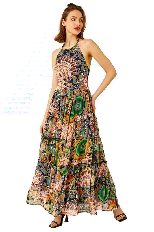 Abstract Halter Neck Tiered Maxi Dress from Roman. Give a nod to the psychedelic 70’s with this printed maxi dress. Cut from a smooth woven fabric this piece features a modest round neckline and is designed in a Summer-ready sleeveless, halter neck style. Adorned in a mesmerising mixed print this piece falls in tiers in a fit and flare style to a modest maxi length. Pair with barely-there heels and a jacket for a garden party or add sandals and a light knitted cardigan for evening beach walks!