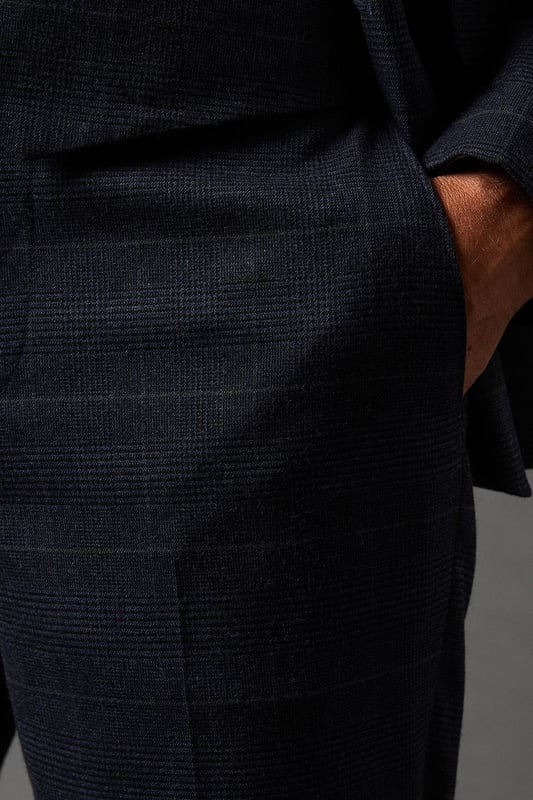 Tailored fit trousers for a refined silhouette
        Distinctive pow check pattern adds visual interest
        Side pockets for practicality
        Belt loops for versatile styling options
        Tapered leg design for a modern look
    
    These Burton pow check trousers offer a sophisticated twist on classic tailoring. The tailored fit sculpts your silhouette while providing comfort and ease of movement. Perfect for the discerning gentleman who appreciates timeless style with a contemporary edge. Pair with the matching jacket and waistcoat for a complete suit that commands attention at formal events or important business meetings. For a smart-casual ensemble, team with a crisp white shirt and leather brogues. The versatile design allows for effortless transition from day to night, making these trousers an essential addition to any well-curated wardrobe. Whether you're heading to the office, attending a wedding, or enjoying a night out at your local pub, these trousers will ensure you look polished and put-together.