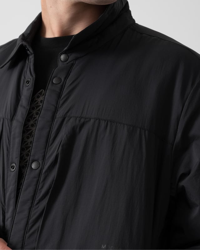 Meet your new wardrobe staple: the shirt jacket, where versatility meets style. Transition effortlessly from casual outings to laid-back evenings.


Warmth & Protection


Protection Rating - Level 1: Chilly – Ultra-light and minimal. Wear these garments to take the chill off breezy nights or as layering option when things get colder than expected.
Water Repellent, Water Resistant, Wind Resistant




Design & Function


Shirt Collar
Placket with Snap Closure
2 Pockets with Zipper Closure on Chest2 Pockets with Snap Closure below Waist
Adjustable Cuffs with Snap Closure
Rubber Patch with Gunmetal Metal Logo"Moose Knuckles - Engineered in Canada" Print on Chest Pocket


COMPOSITION



Body: 100% Nylon
Lining: 100% Recycled Polyester


FILL

Polyfil 100% Recycled Polyester
 
M34MJ195


 



 



 