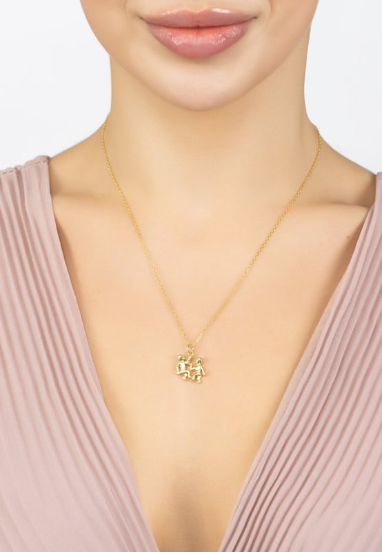 If you're looking for a necklace that's both stylish and informative, then this is the perfect piece for you! The Zodiac Star Sign Necklace is a great way to show off your astrological side.Handcrafted with 925 sterling silver and dipped in 22ct gold it features the celestial motif for Gemini, the twins. Perfect for those that celebrate birthdays between the 21st May to 20th June. The third astrological sign in the Zodiac Geminis are the social butterflies of the zodiac. Find them buzzing between happy hours, dinner parties and dance floors. Gemini signs are in love with love, and they adore the ritual of it all, from those "do they like me?" butterflies to the anticipation of a back-and-forth text volley. Gemini loves dating, but will eventually settle down, because this sign is incredibly loyal once they've chosen a partner.The necklace also comes with a 40-45cm chain, so it can be worn at a length to complement any neckline. Or layer with other necklaces to create your own unique styling. It measures 1.5 x 1cm and weighing only 3grams, this necklace is not only beautiful but also lightweight and comfortable to wear.Show your zodiac pride with this stylish and unique piece of jewellery. The Zodiac Star Sign Necklace is ideal for astrology fans, those who love celestial-themed accessories, or anyone who wants to show their interest in the stars.Whether you're treating yourself or buying a gift for a loved one, this necklace is sure to impress.