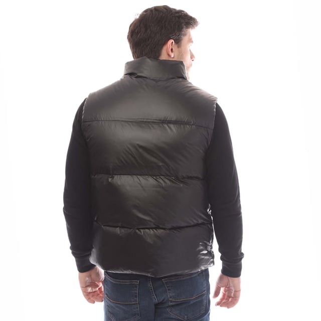 Mens Belstaff Down Filled Ripstop Resolve Gilet in black.- Hood and hem drawcord.- Water resistant double centre front zip.- Zip fastening hip pockets.- Silicone phoenix badge on the chest.- Packable functionality.- 750 fill power down.- 100% RDS certified down and feather (IDFL CERT TE-00103785) with PFAS free water-repellent finish.- High-shine  100% recycled nylon in a micro ripstop construction.- High performance  lofty  ultralight and highly insulating down gilet style.- 100% Polyamide.- Ref: 105160BLACK