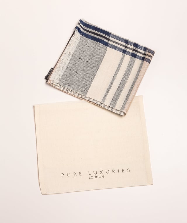 The 'Mono' pashmina from Pure Luxuries London is woven from 50% cashmere and 50% merino wool blend for a soft yet durable feel. Features a monochromatic design with contrasting stripes. Create eye-catching looks with this beautiful and classic accessory. Can be worn multiple ways around the neck, depending on your preference. Pair with our other cashmere accessories. Presented in a 100% cotton Pure Luxuries branded pouch, ideal for gifting.