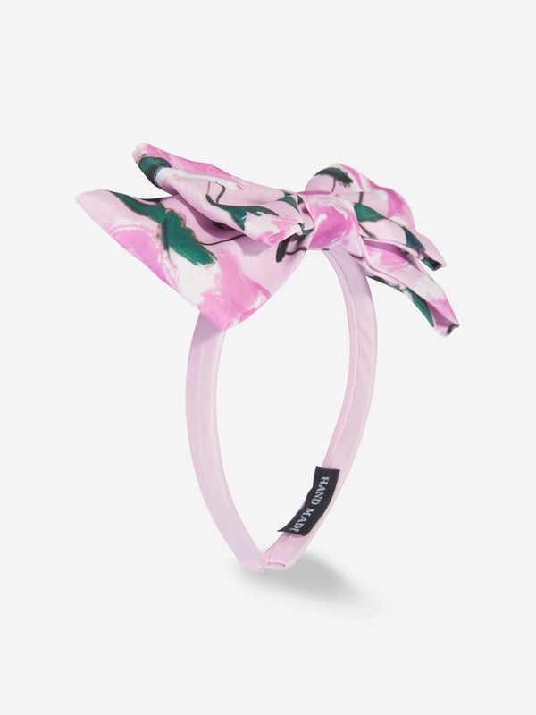 Mama Luma incorporate beautiful eco-friendly materials into their sophisticated handmade aesthetics. This girls pink headband is reflective of the Californian label's precision of beauty. Crafted in a top bow with floral patterning for a sweet finish. She will be obsessed. ‚ Handmade‚ Floral Patterning‚ Polyester‚ Bow‚ One Size
