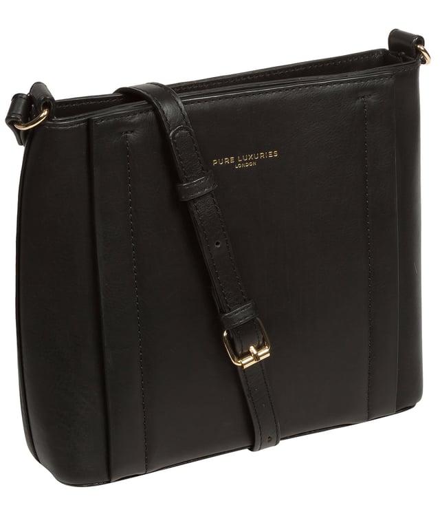 The 'Kali' cross body bag from Pure Luxuries London's Knightsbridge Collection is handcrafted from gold standard Nappa leather with a super-soft and smooth finish. The zip-over top opens to reveal a 100% cotton interior. The spacious compartment features four card slots to help maintain an organised bag. A slip pocket on the front of the bag provides on-the-go storage. Features gold-coloured metal fittings and zips alongside the adjustable slim leather strap with a maximum drop length of 65cm. The Pure Luxuries logo is embossed in gold foil for a beautifully simple finishing touch.