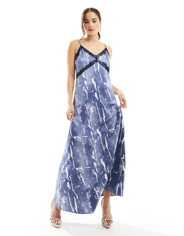 Vero Moda satin maxi slip dress with lace trim in blue crinkle print Dresses by Vero Moda Best dressed: secured V-neck Adjustable straps Lace trim Zip-back fastening Regular fitSold By: Asos
