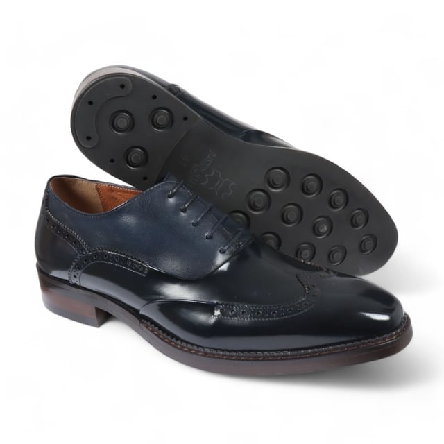 Make a bold impression with the Justin Reess Harry Men's Patent Leather Brogue Shoes in striking green. Crafted from vibrant green patent leather, these shoes are designed to stand out and elevate your formal attire. Featuring a classic brogue design with intricate perforations and decorative stitching, they embody elegance and sophistication for any occasion. The secure lace-up closure allows for a customizable fit, ensuring comfort throughout the day. Built with high-quality materials and expert craftsmanship, these shoes offer durability and longevity, making them a stylish addition to your wardrobe.

Striking Green Patent Leather for a bold statement
Classic Brogue Design with elegant perforations
Lace-Up Closure for a secure, adjustable fit
Durable Construction for long-lasting wear