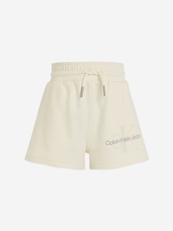 Indulge in the luxury of Calvin Klein with our stylish Girls Monogram Embroidered Shorts in Beige. Essential for any young fashionista's collection, these shorts command attention while remaining charmingly playful. Key features include: High-End Design: Evident in the chic monogram embroidery, Calvin Klein‚ unmatched craftsmanship exudes in every stitch.  Premium Quality: Tailored from fine fabric, ensuring both durability and comfort for your little girl's all-day activity. Versatile Trend: The neutral beige toned shorts easily coordinate with any top, enabling versatility in styling.Revolutionize your girl's wardrobe with these elegant designer shorts. Order now for a distinctive Calvin Klein touch in your child's outfits!