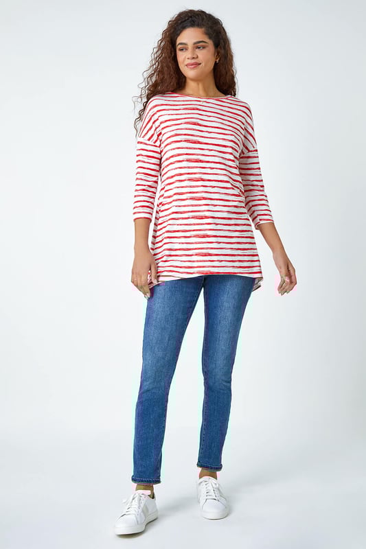 Abstract Stripe Print Stretch Top from Roman. Stripe it lucky this Spring with our newest casual top. Keeping the warmer weather in mind, this striped top is cut from a lightweight stretch jersey for a comfortable style that’s designed for all day wear. It has a modest round neckline, 3/4 length sleeves and a playful hanky hemline that makes it great for transitioning into the new season. A broken stripe print adds a new twist to the timeless nautical trend. Wear with jeans and trainers for the perfect Summer day style.