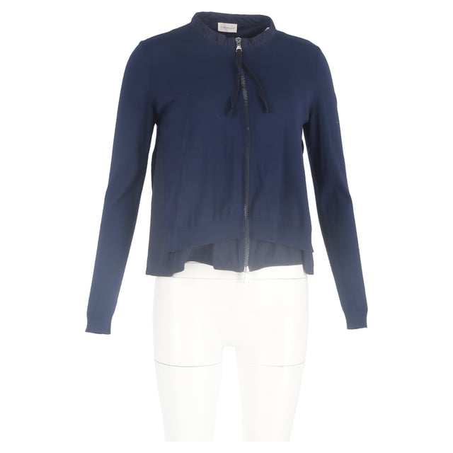 VINTAGE, RRP AS NEW
Add a touch of feminine sophistication to your wardrobe with the Moncler Ruffled Collar Zipped Cardigan in navy blue wool. This luxurious cardigan combines modern design with classic comfort, crafted from soft, breathable wool that provides warmth and a cozy feel, while the rich navy blue hue offers timeless versatility.

 Moncler Ruffled Collar Zipped Cardigan in Navy Blue Wool

Condition: Excellent
Signs of wear: No retail tag but Brand tag on., No visible sign of wear., 
Packaging: None
Color: Blue | navy blue
Material: Wool
Size: INT | L/UK14/IT46/US10/FR42
Measurements: Length: 550
SKU: NAPPUGBCL444354W