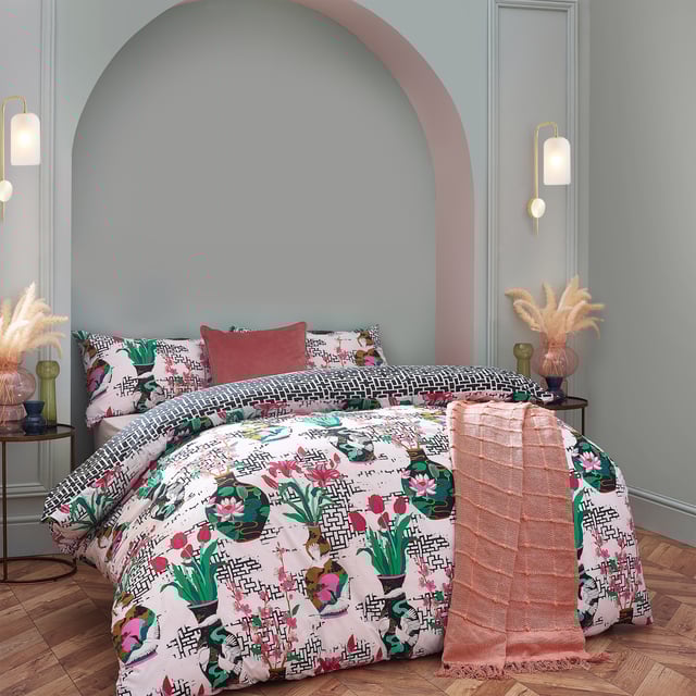 Inspired by Japanese geometric patterns, the injections of colour from the flowers and vases alongside the contrasting geometric monochrome design create a striking and fantastic centrepiece for your bedroom.