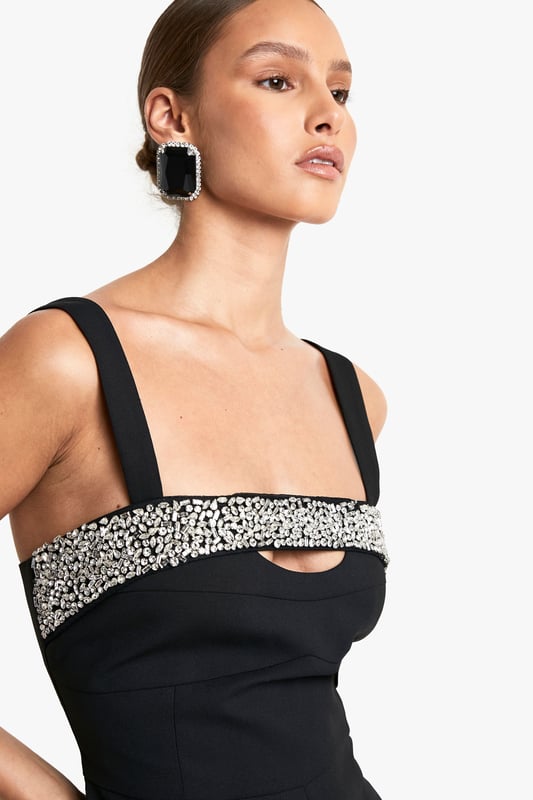 Stunning hand-embellished rhinestone detailing
        Chic square neckline for a modern touch
        Flattering mini length to showcase your legs
        Wide straps for comfortable support
        Sleek playsuit design for effortless style
    
    Make a dazzling entrance at your next festive celebration with this show-stopping playsuit. The hand-embellished rhinestone detailing across the bodice adds a touch of glamour, perfect for catching the light as you dance the night away. The square neckline and wide straps offer a contemporary silhouette, while the mini length allows you to flaunt your legs with confidence. Style this versatile piece with strappy heels and statement earrings for a Christmas party look that commands attention. For a more relaxed Christmas Day outfit, pair it with opaque tights and ankle boots. The playsuit's sleek design ensures you'll feel comfortable and look fabulous throughout the festivities, whether you're opening presents or enjoying a festive meal with loved ones.