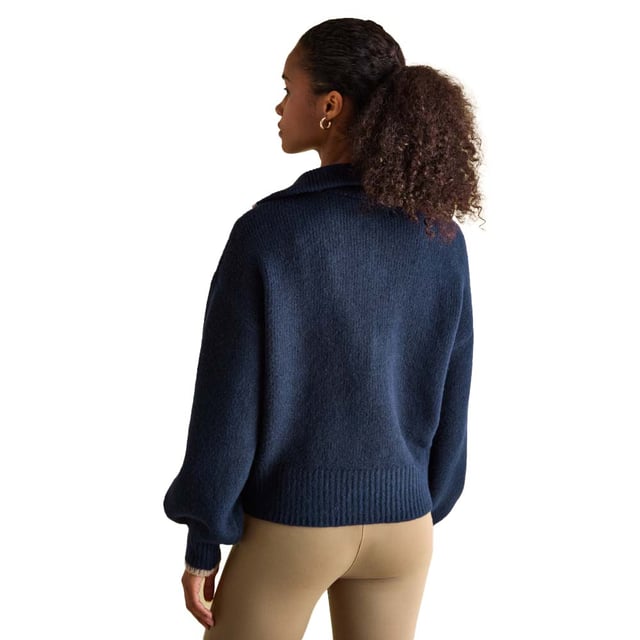 Elevate your knitwear this season with the Elmore navy jumper. Its quarter zip fastening and dropped shoulders gives it an effortless 'throw on' feel, that will keep you comfortable and stylish. The oversized ribbed collar adds interest and features contrasting colour tipping. It's finished with a ribbed hem and cuffs. Style over a slim-fitting top for a layered-up look and your favourite pair of jeans.