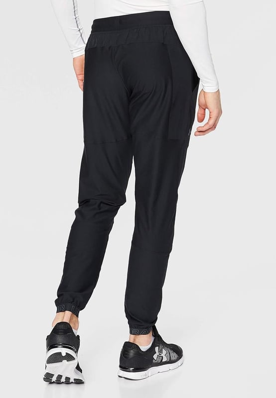 From the streets to the workout, rep these men's Vanish Track Pants from Under Armour. - - . These track pants are cut from smooth, durable poly fabric for lasting wear. - -. Comes In a Black and Grey colourway, they feature an elasticated waistband, with woven ankle cuffs to secure the fit. - -. Finished up with Under Armour branding around the cuffs, and a signature logo at the thigh. Machine washable. - -. Our model is 6'0" and wears medium size.