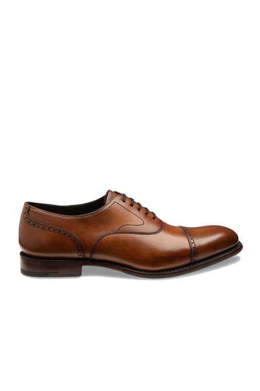 Loake Hughes Hand Painted Shoe Chestnut
A premium semi-brogue with a generous fit and bold toe shape. The light brogue detailing and straight toe cap gives Hughes and uncomplicated design, boasting effortless class and style to be worn easily with suiting or chinos.

100% Premium Leather
Rubber & Leather Goodyear welted sole
Semi Brogue
Unique Finish from Hand Painted Technique
Style - HUGHES