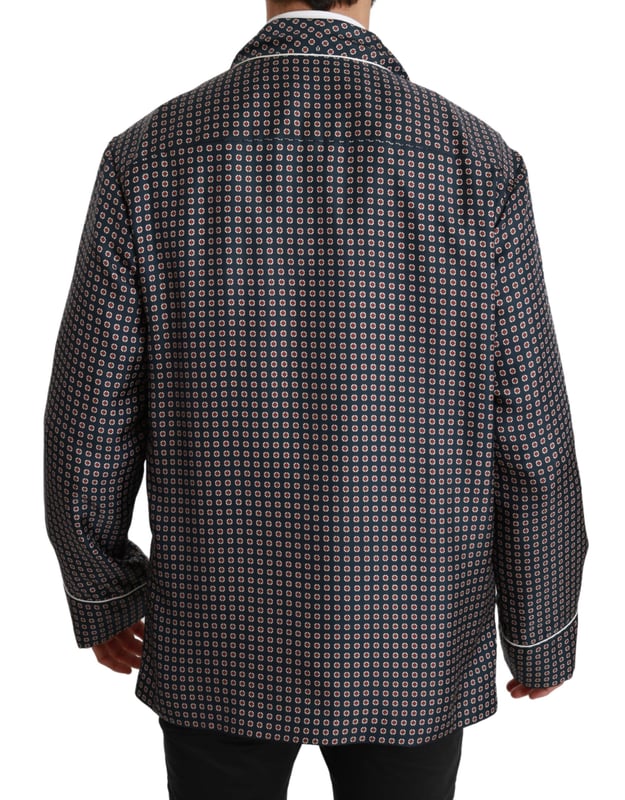 Merk: Dolce & Gabbana
  Stijl: jas met dubbele rij knopen
  Kleur: Marineblauw met patroon
  Sluiting: Knoop
  Pasvorm: Normale pasvorm
  Drie buitenzakken
  Logo details
  Vervaardigd in Italie
  Materiaal: 100% Zijde
  Voering: 100% Zijde