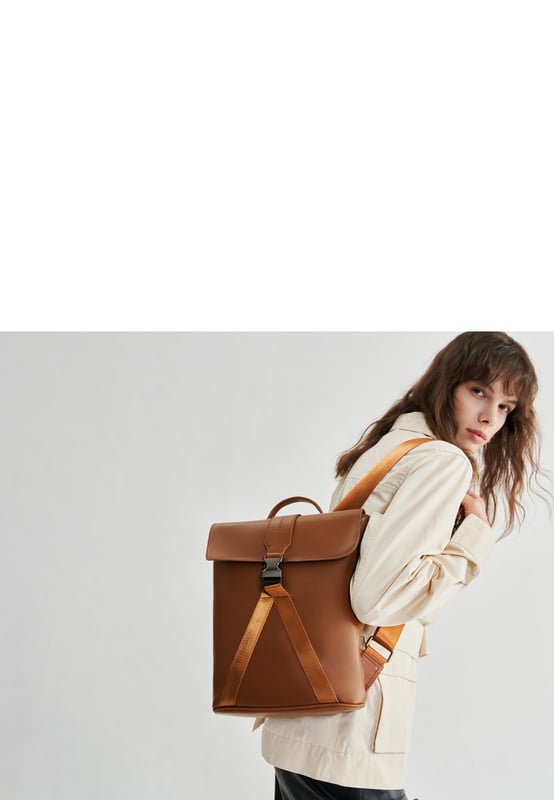 This contemporary style is perfect for those seeking practicality with style. Crafted with smooth leather, the bag oozes premium quality with a flap over front with gunmetal clip buckle and a leather grab handle. The premium nylon webbing shoulder straps are adjustable, providing comfort for the wearer as well as being durable. Inside reveals signature Smith & Canova lining and zip and fold pockets for any valuables. The exterior features a Smith & Canova debossed logo as well as an extra zip pocket. Features: , Smooth leather, Smith and Canova debossed logo, Flapover front with clip buckle fastening and nylon webbing, Gunmetal hardware, Leather grab handle, Adjustable premium nylon webbing shoulder straps, Smith and Canova signature lining, Internal zip and fold pockets, Padded 9 inch tablet slip pocket with Velcro tab fastening, External vertical zip pocket on the back, Smaller size Style Ref: 93056 TAN