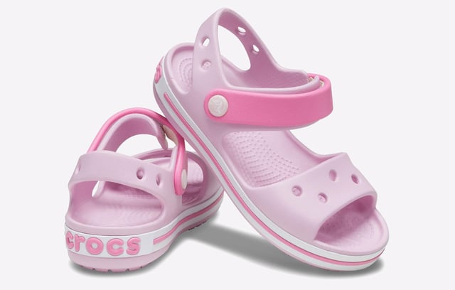 They will dazzle in our kids sandal with cute colours and a comfy fit. Jibbitz charm holes let them add a personal touch.
- Sporty Crocband style for little ones
- Croslite material cushions and comforts
- Heel and ankle strap for a more secure fit
- Comfort Rating: Iconic