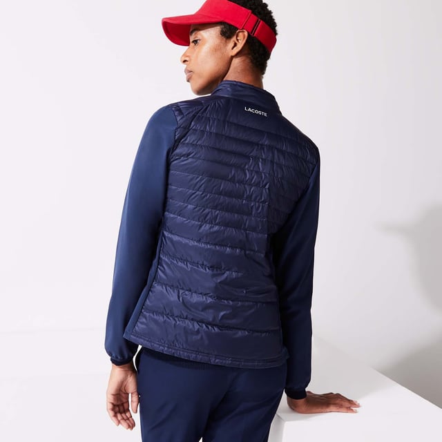 Women's Lacoste SPORT Down Technical Golf Jacket- Buttoned stand-up collar- Lightweight  water-resistant technical mini ripstop fabric with feather and down quilting- Zip side pockets- Stretch panels on sides and elasticised accents on sleeves - Green crocodile transfer on chest- Ref: BF9267-423