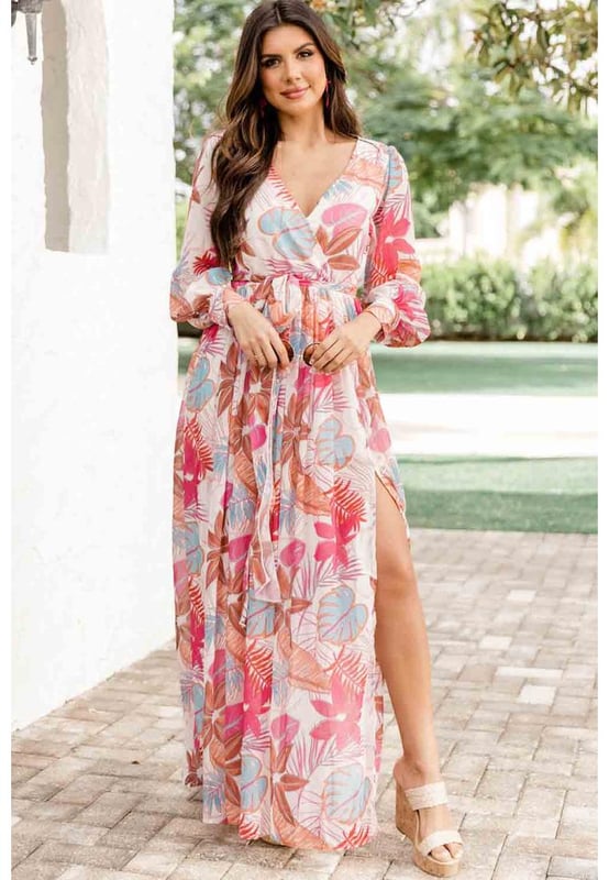 Tropical plant print adds a touch of nature
  Long sleeves provide coverage
  Wrap design and V-neckline create a flattering silhouette
  Slit detail adds a hint of allure
  Made from Quality materials
  Suitable for both casual and formal occasions