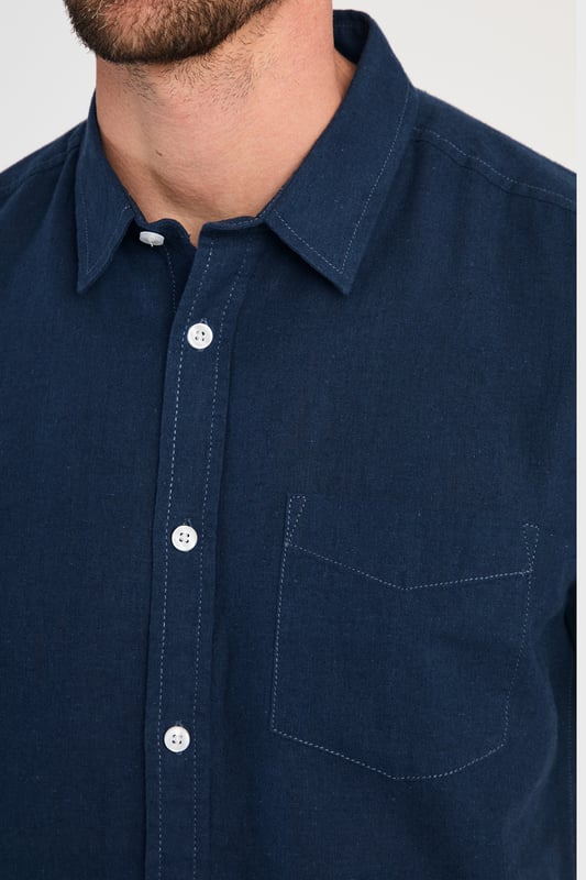 Blue Linen Blend Short Sleeve Button-Up Shirt With Chest Pocket Upgrade your summer wardrobe with this short-sleeved, linen shirt from Tokyo Laundry. Made from a breathable blend of linen and cotton, this shirt offers comfort and style with its classic fit. The shirt features button fastening and a chest pocket. Machine washable for easy care.