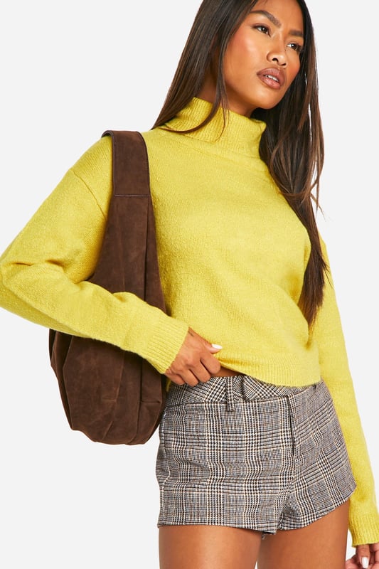 Seeking a pullover jumper that brings super flattering vibes? Look no further than this cute cropped jumper. With the hem cut at or above the waist, this type of short jumper usually comes with long sleeves for maximum style impact and extra warmth. Helping to nip you in at the waist and create an hourglass silhouette, it's a look that will serve attitude over and over again. We wear ours with high waisted denim, slick faux leather trousers and bold animal print skirts for a style that breaks the mould.Style: Lightweight JumperFabric: AcrylicNeckline: Roll NeckSleeve Length: Long Sleeve