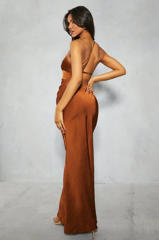 Exquisite satin fabric drapes elegantly over the figure
Asymmetric single-shoulder design creates a sultry, modern look
Pleated detailing at the waist adds flattering shape
Low, scooping back cut reveals an alluring glimpse
Floor-sweeping maxi length exudes glamour and sophistication

Crafted from luxurious satin, this striking dress is perfect for making a statement at formal occasions. The asymmetric single-shoulder neckline and low, scooping back cut create a daring yet refined look. The pleated waist cinches the silhouette, while the maxi length lends an air of elegance. Pair with strappy heels and minimalist jewellery for a showstopping evening ensemble, or style with a tailored blazer for a chic event look.
