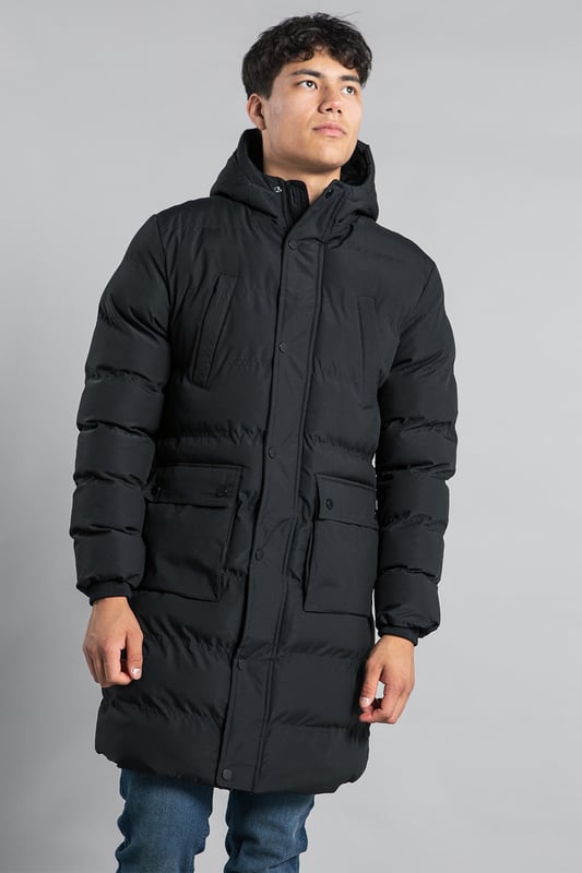 This longline funnel neck hooded padded jacket from Nines by Kensington Eastside will ensure you are kept warm on colder days. Features funnel neck, hood, zip and popper fastening, two large popper fastening pockets and two zip chest pockets, ribbed elasticated cuffs for comfort, and inside fur lining in half the jacket.