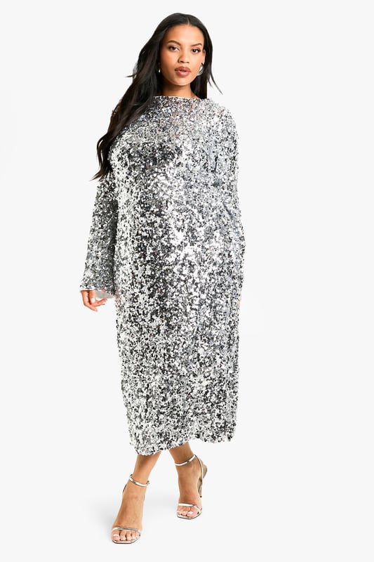 This plus size shift dress is the ultimate style of the season. A short dress that hangs straight down from the shoulders with clean and simple lines, we love this style for its ultimate comfort and super flattering fit. Seeing you through from daytime plans to evening drinks, just pair with statement heels and a matching clutch...sorted. An ideal alternative to a bodycon, this floaty dress will look good on you girl. Need more inspo? A plus size shift dress with sleeves is the perfect transitional piece and looks just as good worn with trainers as it does lace-up heels. Style: Shift DressFabric: SequinLength: MiniSleeve Length: Long Sleeve