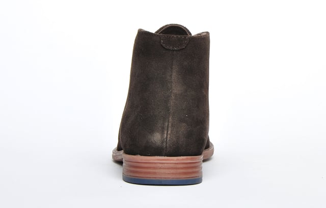 A signature style from Catesby England, this Austell Chukka desert style boot is crafted from a premium suede leather and is a timeless, reliable mid cut boot that will go with any outfit to complete that smart casual look.
 This premium mens boot with its high-end suede leather upper and durable grippy rubber sole, is finished with intricate designer stitch detail throughout providing on-trend wear wherever you go. Stitch work and panelling throughout add originality making the Catesby England desert boot a stand-out from the crowd model. A slim line durable outsole completes the on trend look making the Catesby England a boot perfect for work, or to enhance your casual everyday outfit with a bit of formality this season.
 - Premium suede leather upper
 - 3 Eyelet lace up fastening
 - Comfortable inner lining
 - Intricate designer stitch detailing
 - Additional laces included to change your look
 - Durable rubber outsole