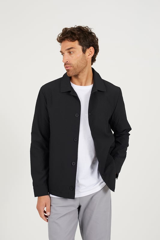 Upgrade your layering game with this shacket from Brave Soul, designed to combine the best of a shirt and jacket for all-season wear. Featuring a classic button fastening, the regular fit ensures a comfortable, relaxed silhouette, making it ideal for layering over t-shirts or hoodies. With two lower pockets, you have plenty of space to keep your essentials, while the all-over texture adds a unique, stylish touch that elevates the classic design. Model wears UK size M.