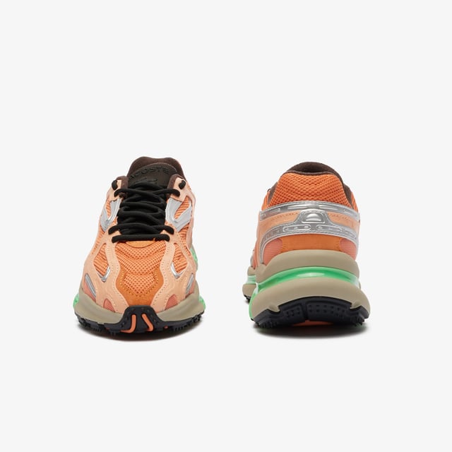 The L003 2K24 is the step to the future of Lacoste sneaker design language. This sneaker is built for today’s fashion-sneaker connoisseur - harnessing sport  style and tech features for a fresh and unique design aesthetic. The sporty mesh upper is layered with suede and multiple embossed metallic leather panels  harnessed by an outer cage which features the Lacoste Active branding details. The light EVA midsole features a dynamic shiny TPU stabiliser for support and stability together with a textured rubber outsole. • Progressive Running Sneaker • Breathable Mesh Upper with Synthetic overlays • Synthetic metallic panels with embossed detailing • Outer Synthetic Leather Cage design printed with Active Branding • EVA midsole with TPU support • Textured rubber outsole • Rounded rope laces • Mesh lining