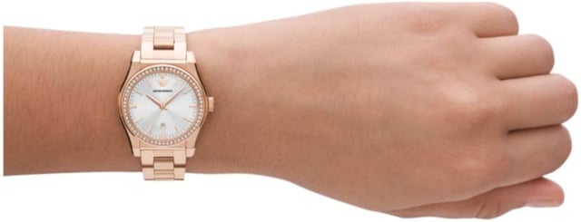 This Emporio Armani Federica Analogue Watch for Women is the perfect timepiece to wear or to gift. It's Rose Gold 32 mm Round case combined with the comfortable Rose Gold Stainless steel watch band will ensure you enjoy this stunning timepiece without any compromise. Operated by a high quality Quartz movement and water resistant to 5 bars, your watch will keep ticking. This elegant, fashionable watch set with beautiful stones is a perfect gift for New Year, birthday,valentine's day and so on This Analogue watch has a Calendar function: Date High quality 19 cm length and 15 mm width Rose Gold Stainless steel strap with a Deployment clasp Case diameter: 32 mm,case thickness: 9 mm, case colour: Rose Gold and dial colour: Silver